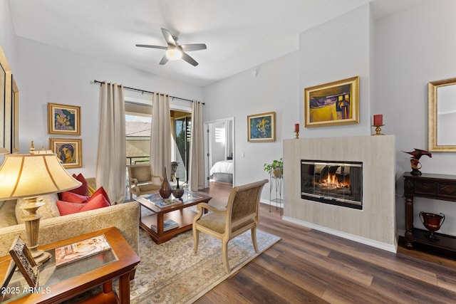 7887 N 16th St Unit 226, Phoenix, AZ 85020 - living room with a ceiling fan, dark wood-style floors, a glass covered fireplace, and baseboards