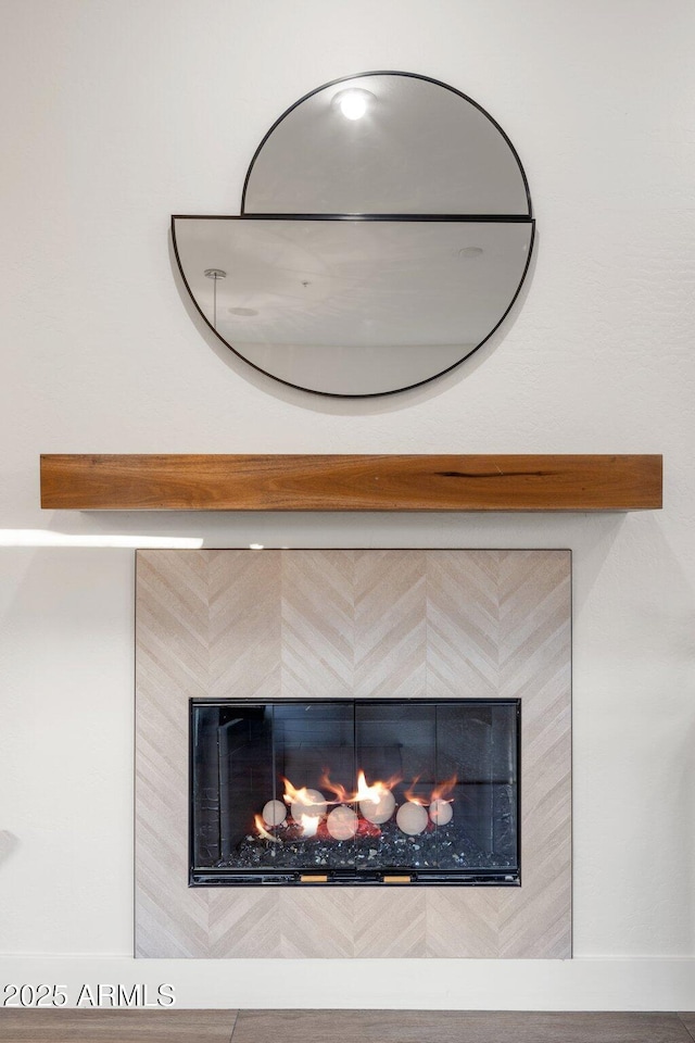 details featuring a tile fireplace