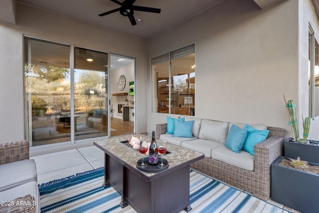 view of patio featuring outdoor lounge area and ceiling fan