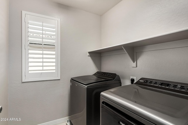 washroom with washing machine and dryer