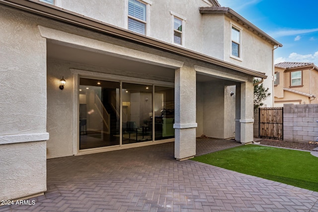 rear view of house featuring a patio area