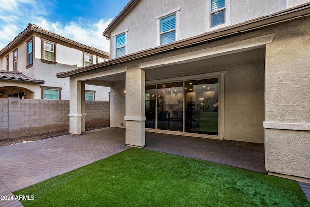 rear view of house featuring a patio