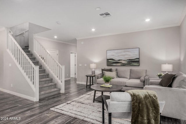 living room with dark hardwood / wood-style flooring and crown molding