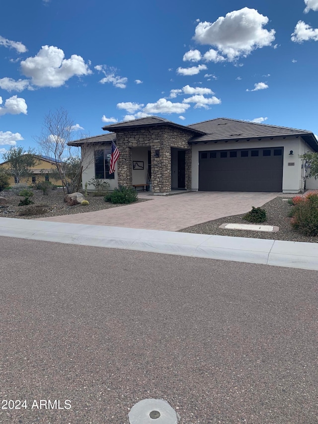 prairie-style house featuring a garage