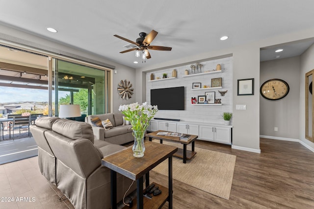 living room featuring light hardwood / wood-style floors and ceiling fan