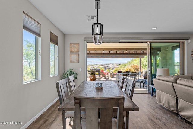 dining area with hardwood / wood-style floors