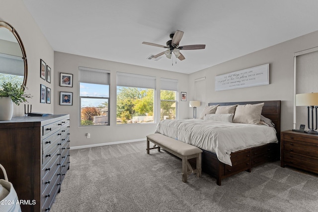 bedroom featuring ceiling fan and light carpet