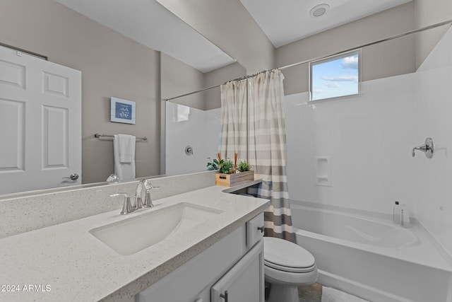 full bathroom with shower / bath combo, vanity, and toilet