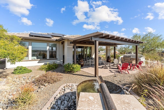 back of house featuring area for grilling and a patio area