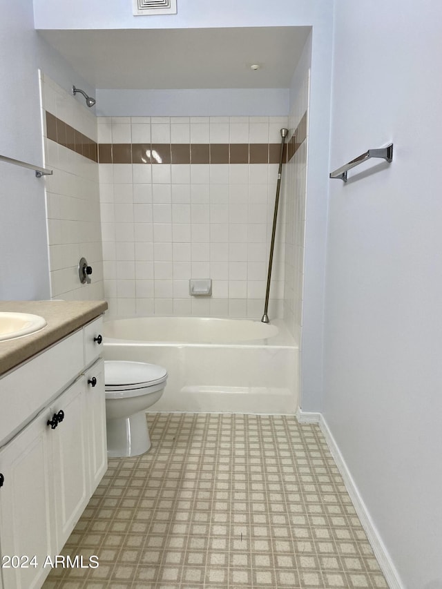 full bathroom featuring vanity, toilet, and tiled shower / bath