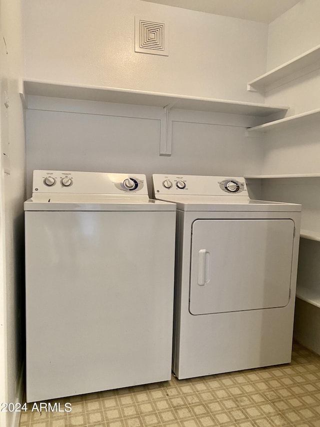 washroom featuring separate washer and dryer