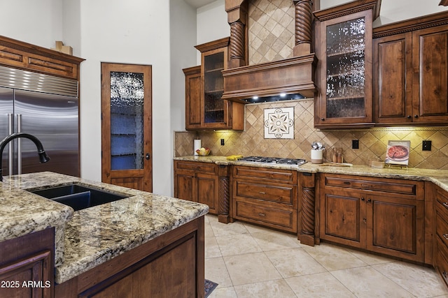 4401 E Taurus Pl, Chandler, AZ 85249 - kitchen featuring a sink, tasteful backsplash, light stone countertops, and appliances with stainless steel finishes