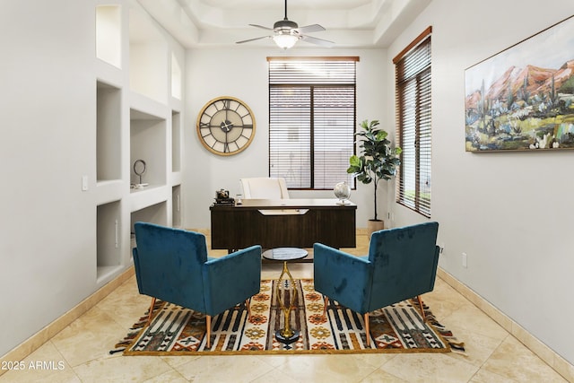 4401 E Taurus Pl, Chandler, AZ 85249 - sitting room with baseboards, built in shelves, tile patterned floors, and a ceiling fan