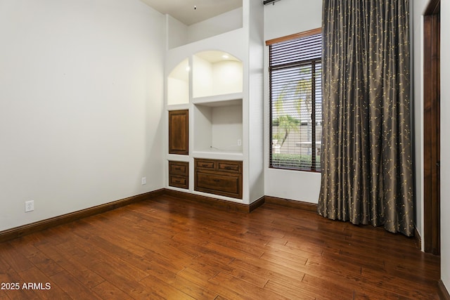 4401 E Taurus Pl, Chandler, AZ 85249 - spare room featuring dark wood-type flooring and baseboards