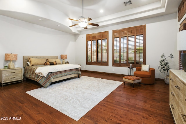 4401 E Taurus Pl, Chandler, AZ 85249 - bedroom with dark wood finished floors, baseboards, a raised ceiling, and visible vents