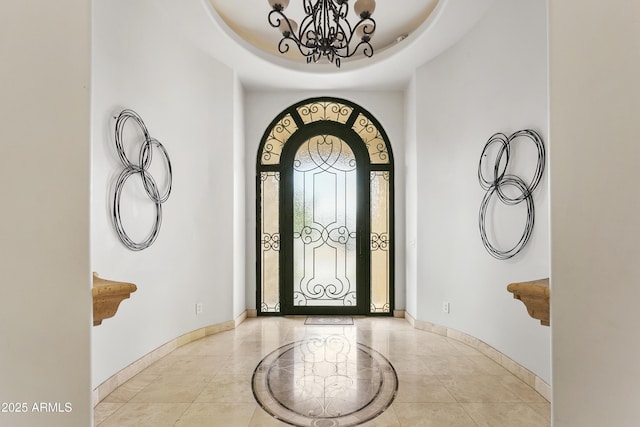 4401 E Taurus Pl, Chandler, AZ 85249 - foyer entrance featuring baseboards, a tray ceiling, and an inviting chandelier