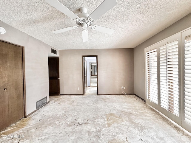 1124 N Villa Nueva Dr, Litchfield Park, AZ 85340 - unfurnished bedroom with a textured ceiling and a ceiling fan