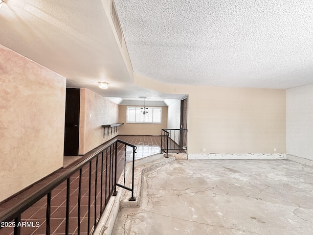 1124 N Villa Nueva Dr, Litchfield Park, AZ 85340 - unfurnished room with a textured ceiling and unfinished concrete floors