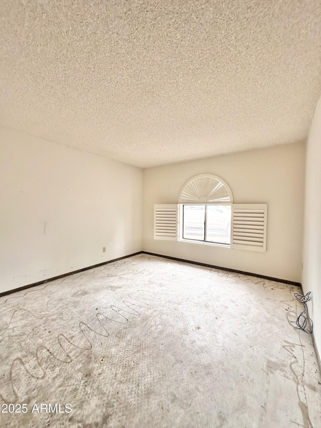 1124 N Villa Nueva Dr, Litchfield Park, AZ 85340 - spare room with a textured ceiling