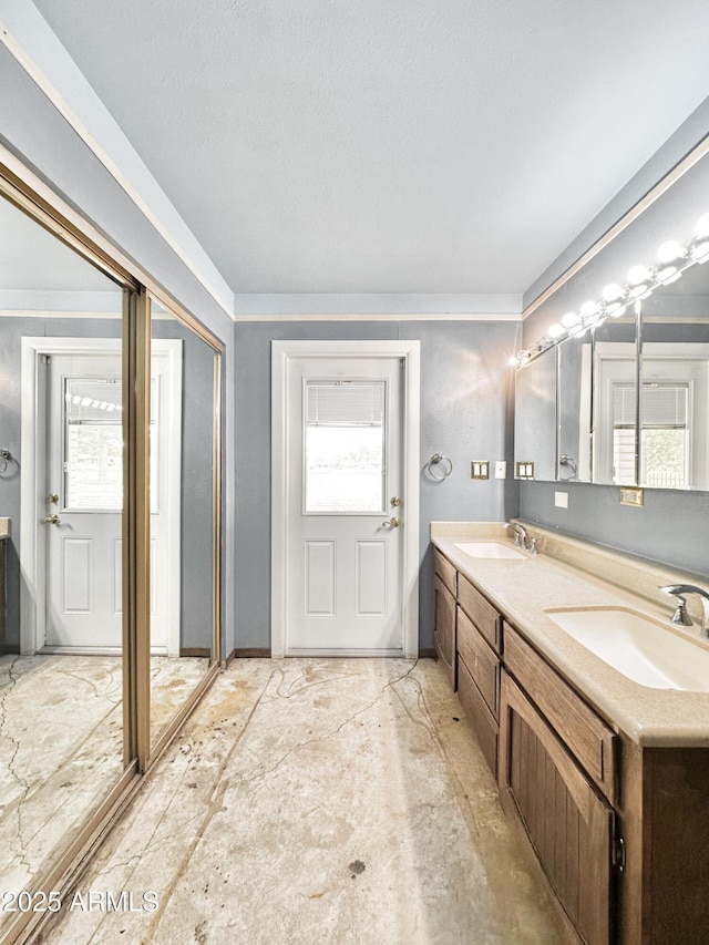 1124 N Villa Nueva Dr, Litchfield Park, AZ 85340 - full bathroom featuring double vanity, plenty of natural light, and ornamental molding