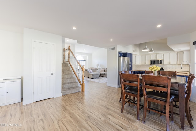 dining room with light hardwood / wood-style flooring