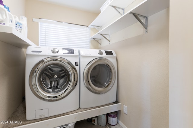 laundry area with independent washer and dryer