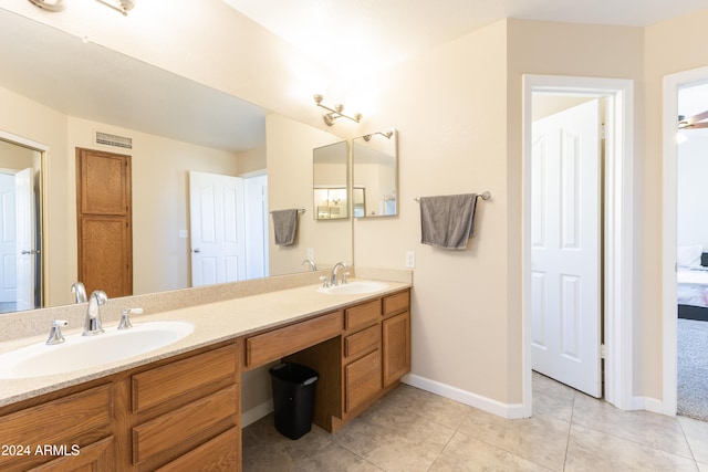 bathroom featuring tile patterned floors and vanity