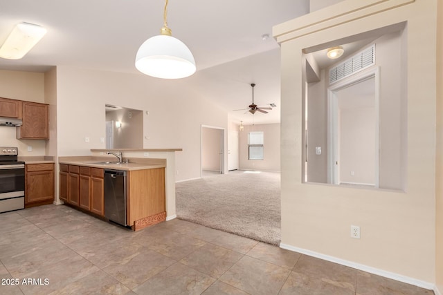 kitchen featuring light carpet, stainless steel appliances, lofted ceiling, and a sink