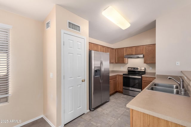 kitchen featuring a sink, stainless steel appliances, under cabinet range hood, and visible vents