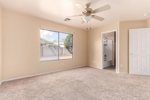 unfurnished bedroom featuring a ceiling fan, carpet flooring, baseboards, and visible vents