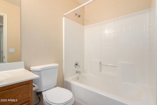 bathroom featuring shower / washtub combination, toilet, and vanity