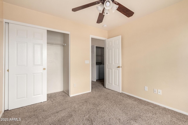 unfurnished bedroom with washer / dryer, baseboards, a closet, and carpet floors