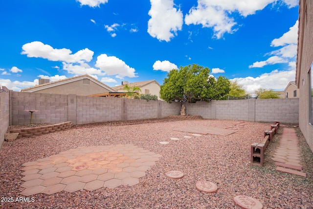 view of yard featuring a patio area and a fenced backyard