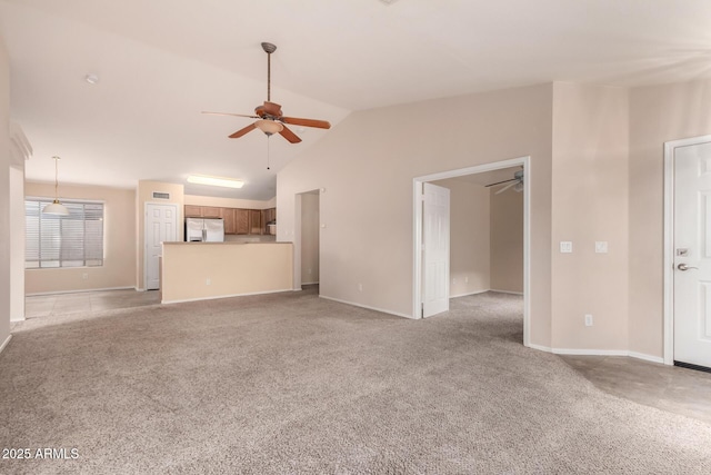 unfurnished living room featuring baseboards, lofted ceiling, light colored carpet, and a ceiling fan