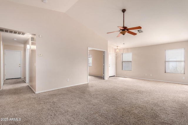 spare room with baseboards, visible vents, high vaulted ceiling, ceiling fan, and light colored carpet