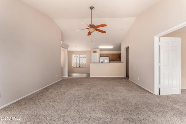 unfurnished living room with lofted ceiling, baseboards, carpet floors, and ceiling fan