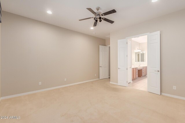 spare room featuring recessed lighting, baseboards, light carpet, and a ceiling fan