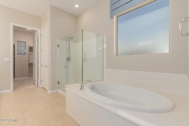 unfurnished bedroom featuring recessed lighting, connected bathroom, baseboards, and light colored carpet