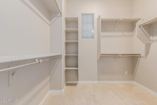 full bathroom featuring vanity, a shower stall, baseboards, and tile patterned flooring