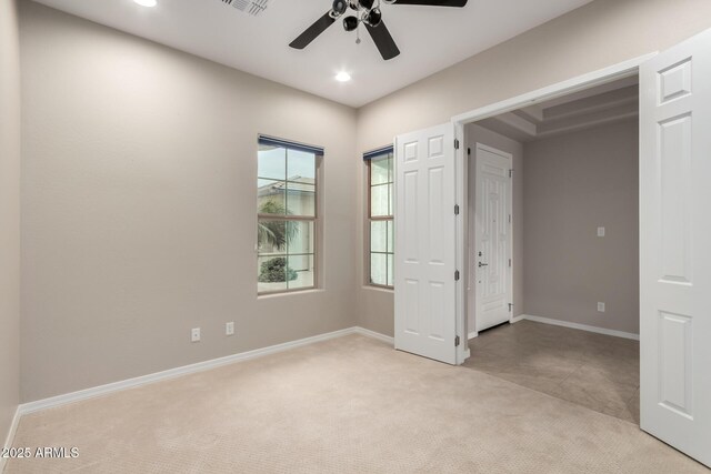 unfurnished bedroom featuring visible vents, baseboards, light colored carpet, recessed lighting, and a ceiling fan