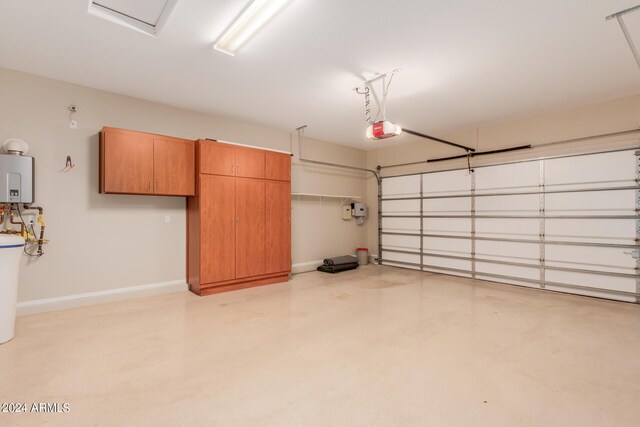 clothes washing area with a sink, washing machine and dryer, cabinet space, light tile patterned floors, and baseboards