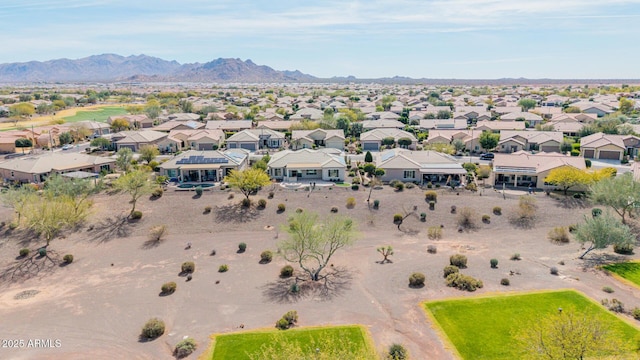 birds eye view of property with a mountain view and a residential view