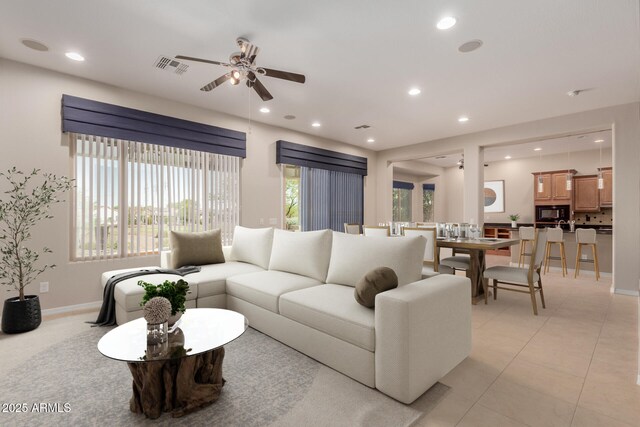 empty room with baseboards, a ceiling fan, and carpet flooring