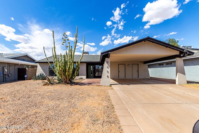 3008 W Michigan Ave, Phoenix, AZ 85053 - ranch-style home featuring stucco siding, driveway, and a carport
