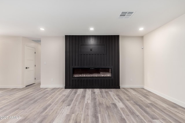 3008 W Michigan Ave, Phoenix, AZ 85053 - unfurnished living room featuring visible vents, recessed lighting, and a fireplace