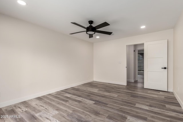 3008 W Michigan Ave, Phoenix, AZ 85053 - unfurnished bedroom featuring baseboards, ceiling fan, recessed lighting, and wood finished floors