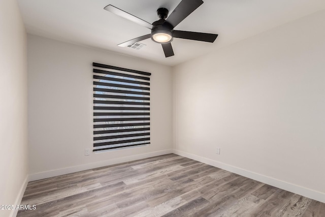 3008 W Michigan Ave, Phoenix, AZ 85053 - empty room with baseboards, ceiling fan, wood finished floors, and visible vents