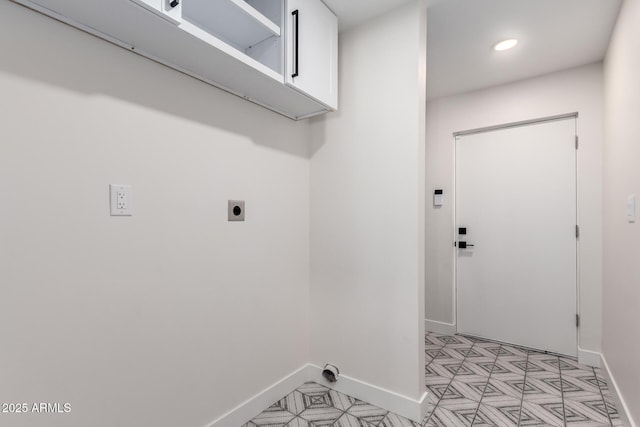 3008 W Michigan Ave, Phoenix, AZ 85053 - laundry area featuring recessed lighting, baseboards, electric dryer hookup, and cabinet space