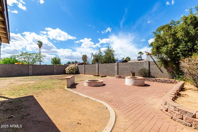 3008 W Michigan Ave, Phoenix, AZ 85053 - view of yard featuring a fire pit and a fenced backyard