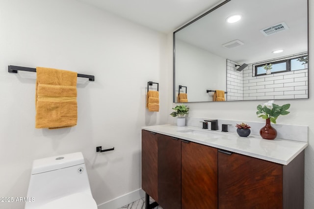 3008 W Michigan Ave, Phoenix, AZ 85053 - bathroom featuring visible vents, vanity, toilet, baseboards, and recessed lighting